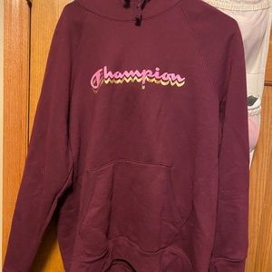 Champion sweatshirt color is maroon. Size 2xL. Never worn.
